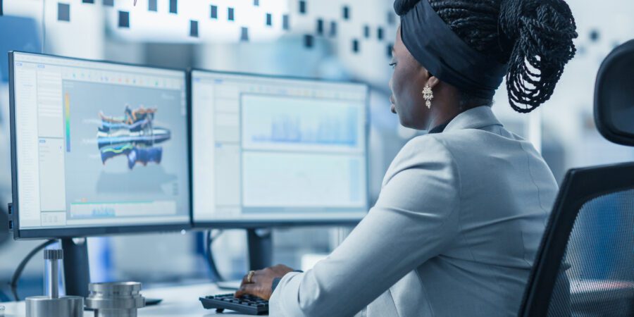 Woman working at desktop computer.