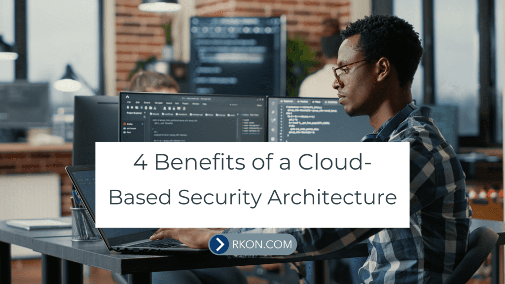 Man sitting at computer desk. 4 Benefits of a Cloud-Based Security Architecture
