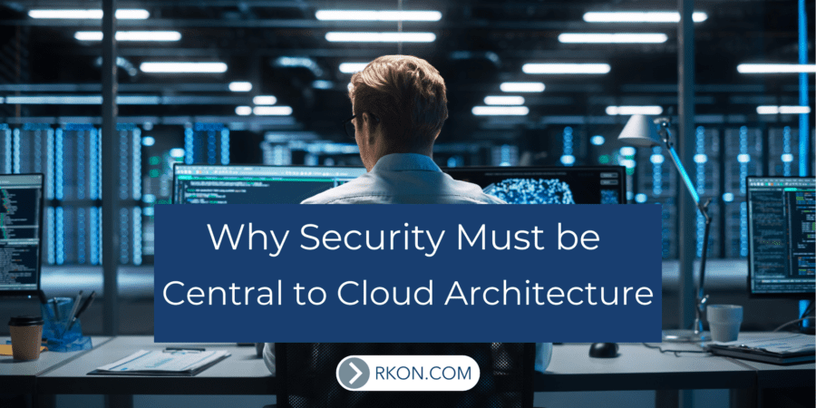 Man sitting at computer desk. Why Security Must be Central to Cloud Architecture