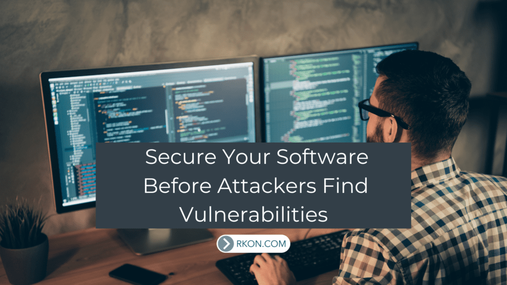 Man sitting at desk looking at computer. Secure Your Software Before Attackers Find Vulnerabilities.