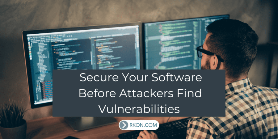 Man sitting at desk looking at computer. Secure Your Software Before Attackers Find Vulnerabilities.